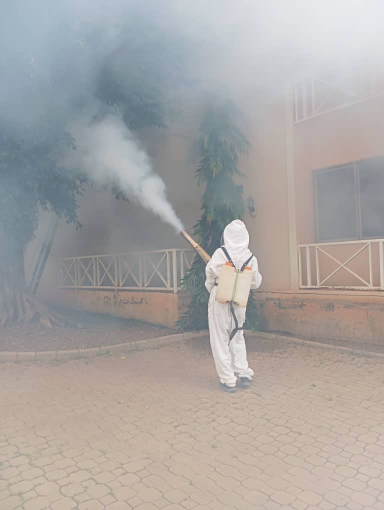 IBPestControl technician with fogging equipment on a truck