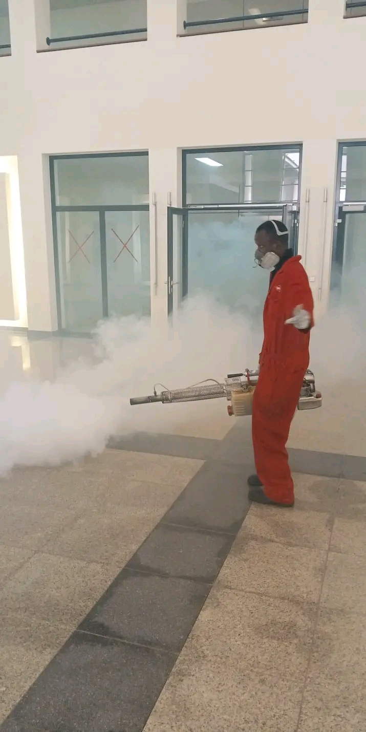 IBPestControl technician fogging a commercial hall in Abuja