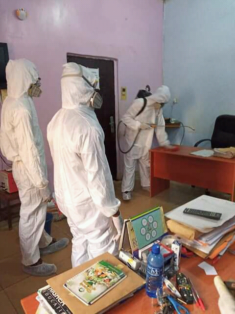Office pest control treatment in protective suits